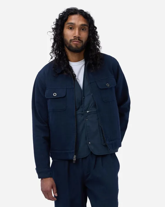 The uploaded front photo of the navy utility overshirt on a model